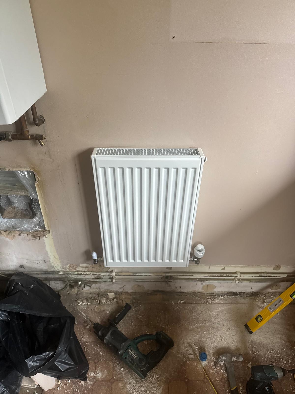 New central heating radiator installed in Corby